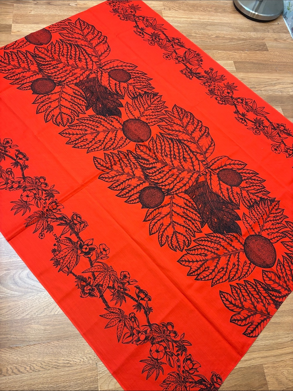 Vintage vibrant red and black botanical print tablecloth.